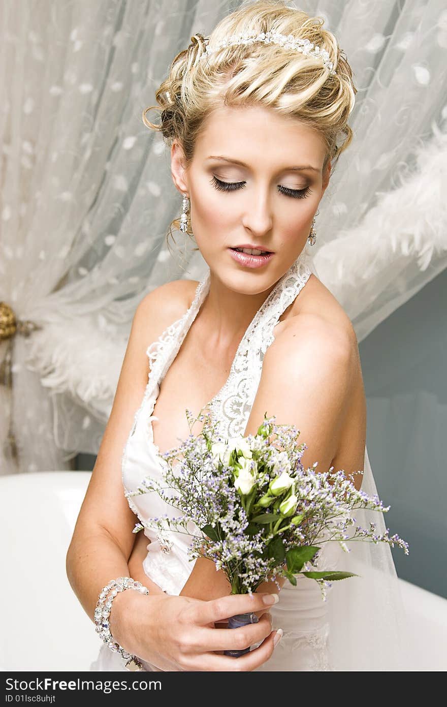 Beautiful Blond bride wearing diamond jewelery and tiara. Beautiful Blond bride wearing diamond jewelery and tiara