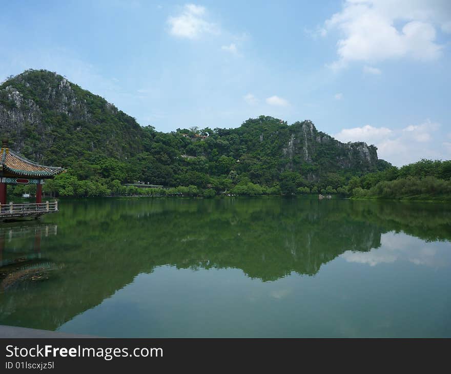 Inverted image of the mountain and clouds were shown on the surface of the lake