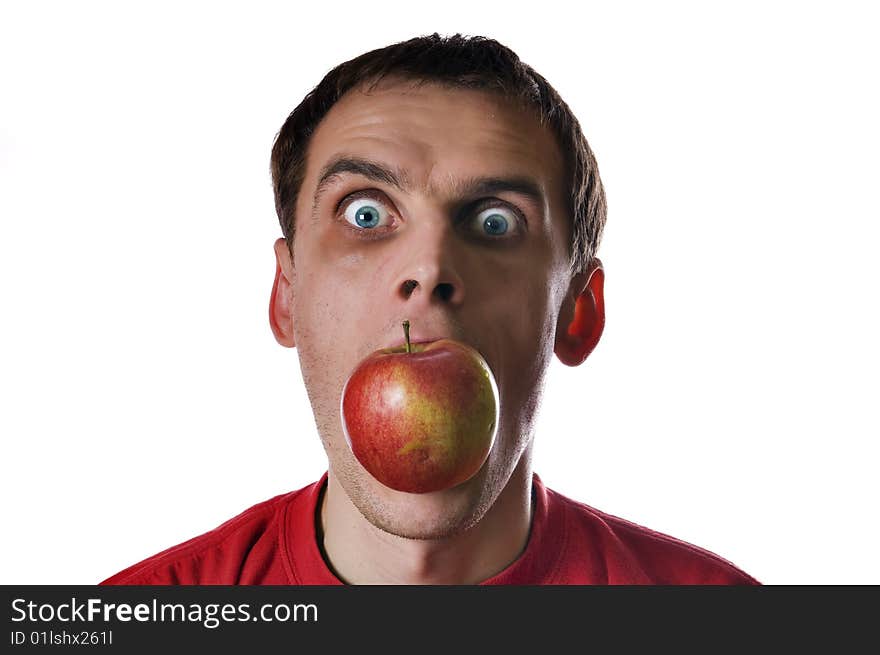 Male head with red apple in mouth