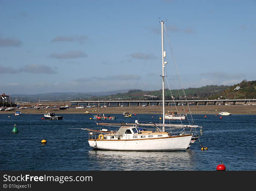 Yacht moored off beach at Teignmouth. Yacht moored off beach at Teignmouth