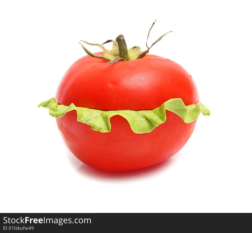 Red tomatoes and green lettuce isolated on white background