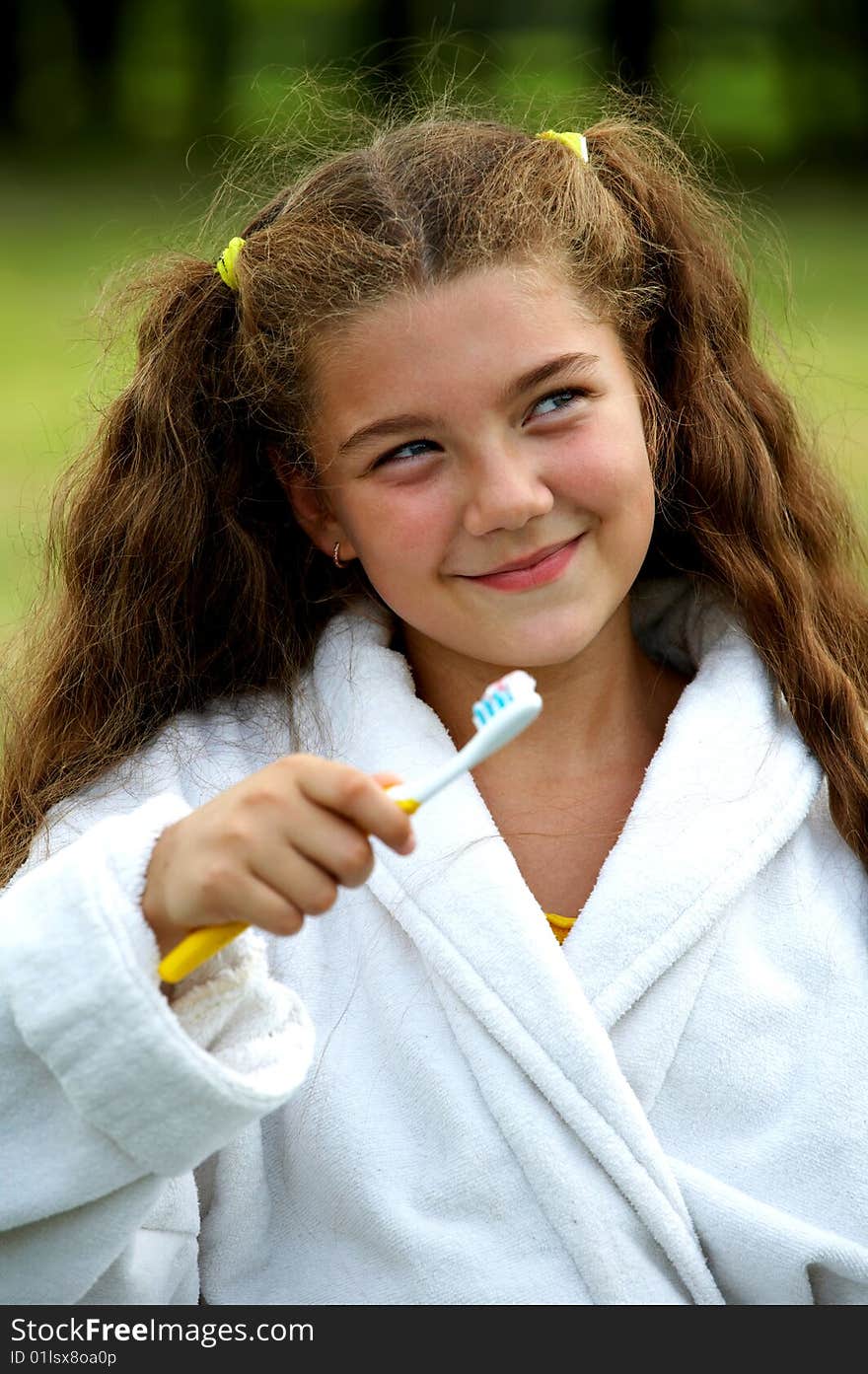 Funny girl brushing teeth