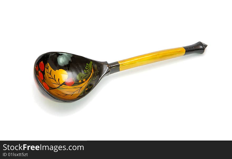 Russian wooden hand-painted spoon on white background. Russian wooden hand-painted spoon on white background