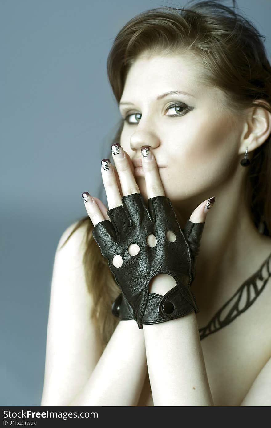 Portrait of girl is in leather gloves