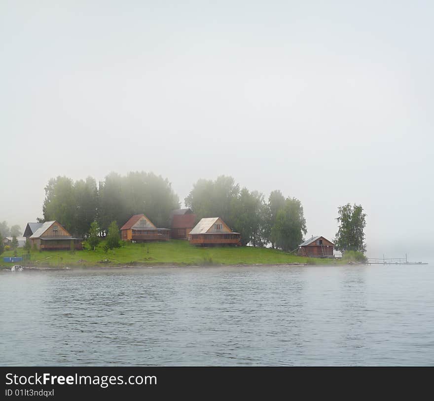 Lake island in fog