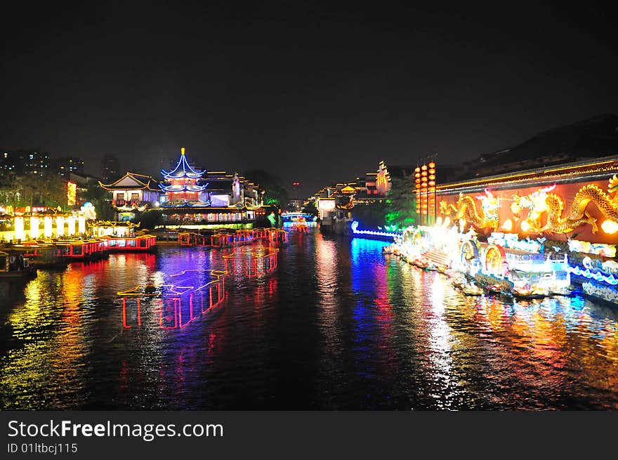 Night scene of Qinhuai river and boats. The Qinhuai River is the cradle of the culture of Nanjing. The Qinhuai River View Area has been the most flourishing place of Nanjing for more than 1,000 years, which is called “ten-kilometer-pearl-decorated curtains”. The most charming view on Qinhuai River is the boat whose name is “gaily-painted pleasure-boats”. They imitate the architectural of Ming Dynasty. The owners like to hang some colorful balls and lanterns on the boats. At night, the light is reflected into the water and adds much vitality to Qinhuai River.