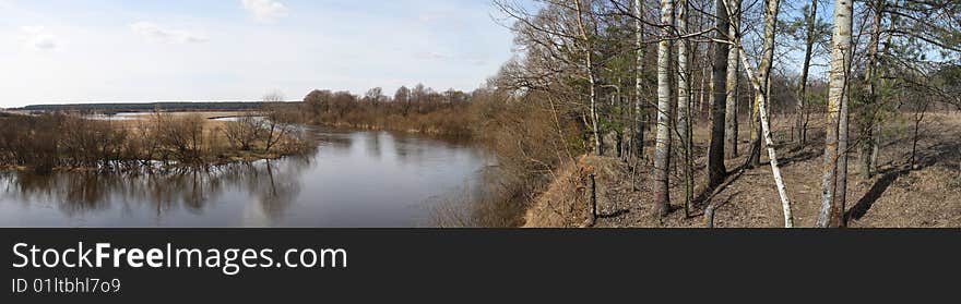 The panorama of river with clouds and reflecting in water. The panorama of river with clouds and reflecting in water.