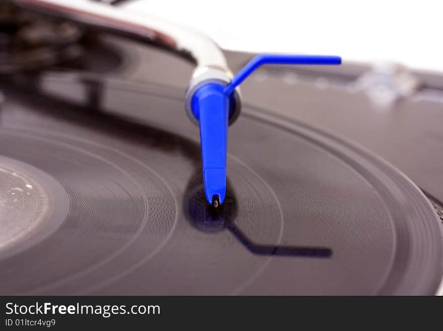 Dj needle on turntable isolated on white