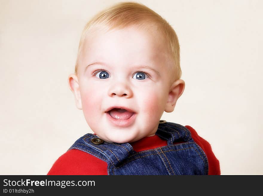 Head and shoulders image of a blond boy. Head and shoulders image of a blond boy