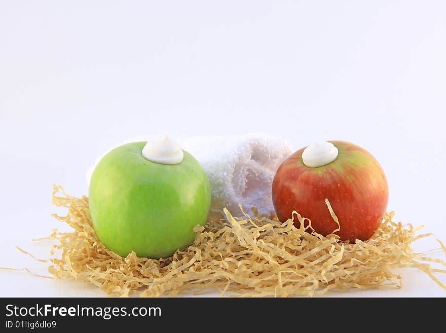 Two apples and cream isolated on white