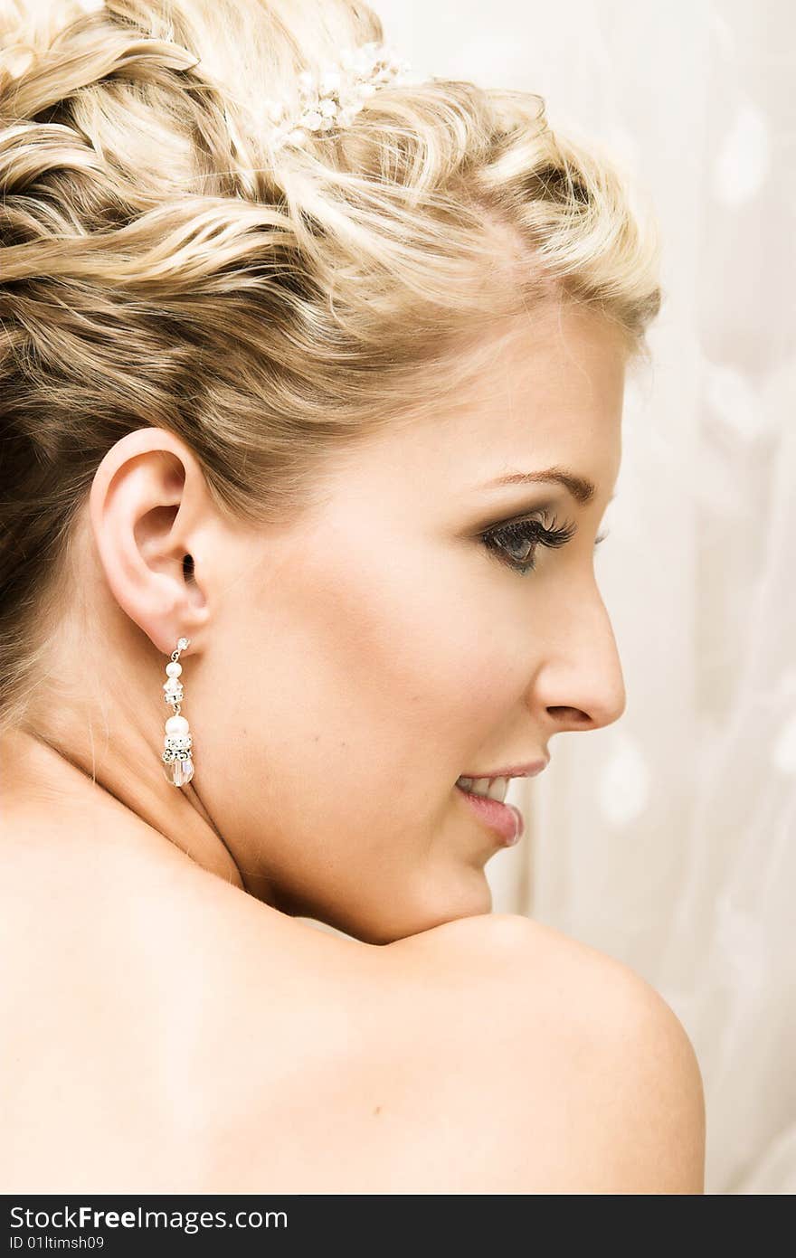 Beautiful Blond bride wearing diamond jewelery and tiara. Beautiful Blond bride wearing diamond jewelery and tiara