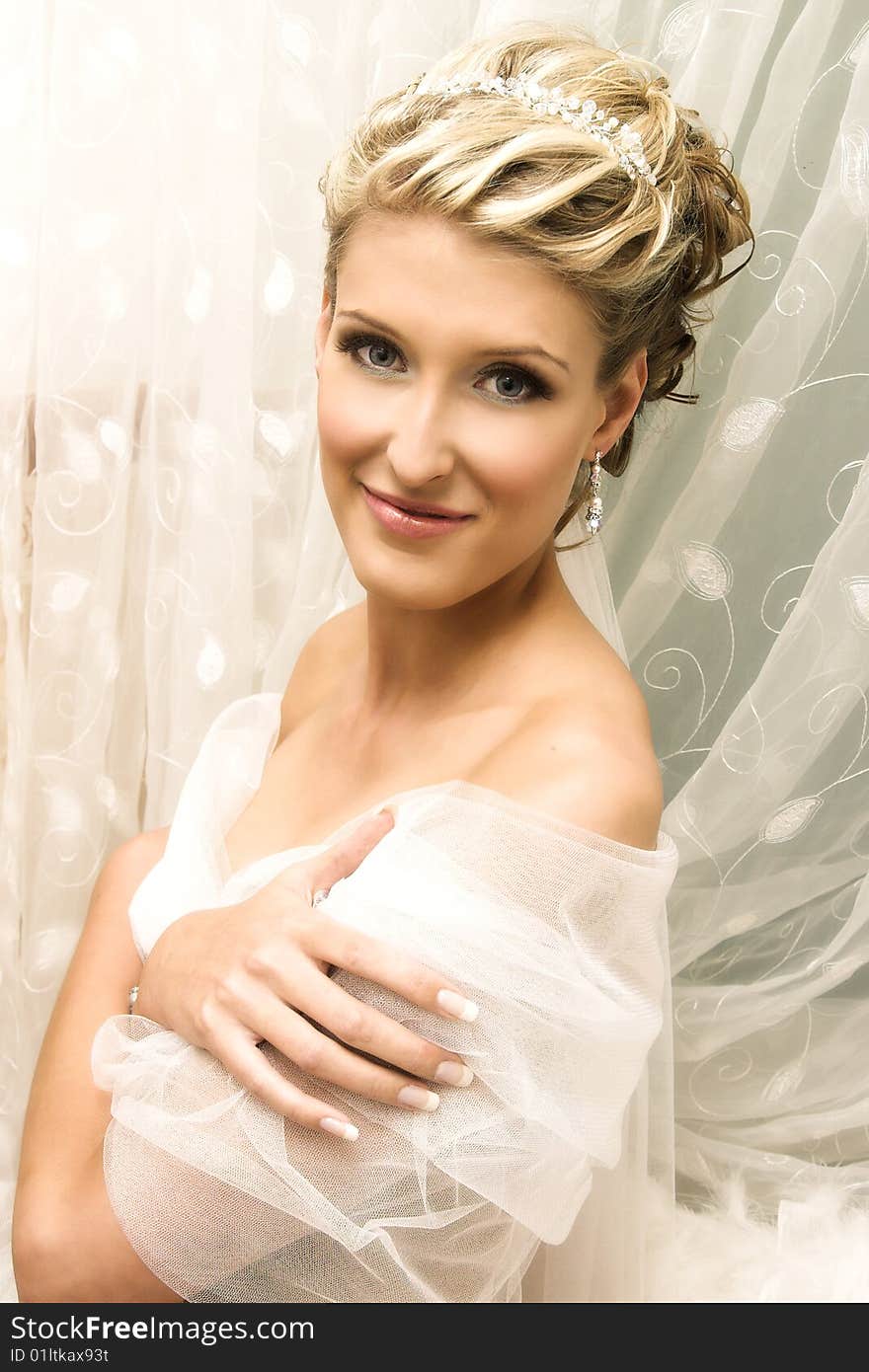 Beautiful Blond bride wearing diamond jewelery and tiara. Beautiful Blond bride wearing diamond jewelery and tiara