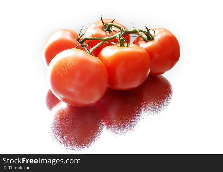 A bunch of tomatoes isolated over white background