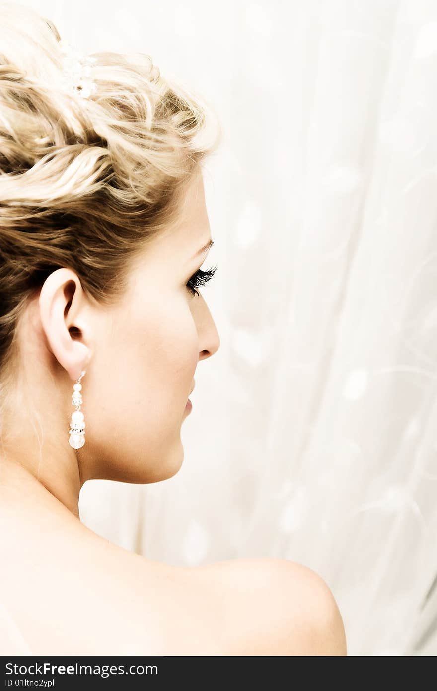 Beautiful Blond bride wearing diamond jewelery and tiara. Beautiful Blond bride wearing diamond jewelery and tiara