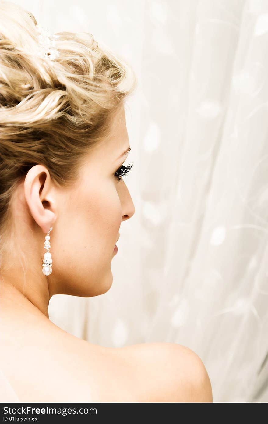 Beautiful Blond bride wearing diamond jewelery and tiara. Beautiful Blond bride wearing diamond jewelery and tiara