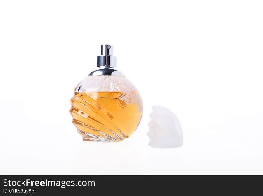 Open bottle of yellow perfume. Isolated object on white background. Open bottle of yellow perfume. Isolated object on white background