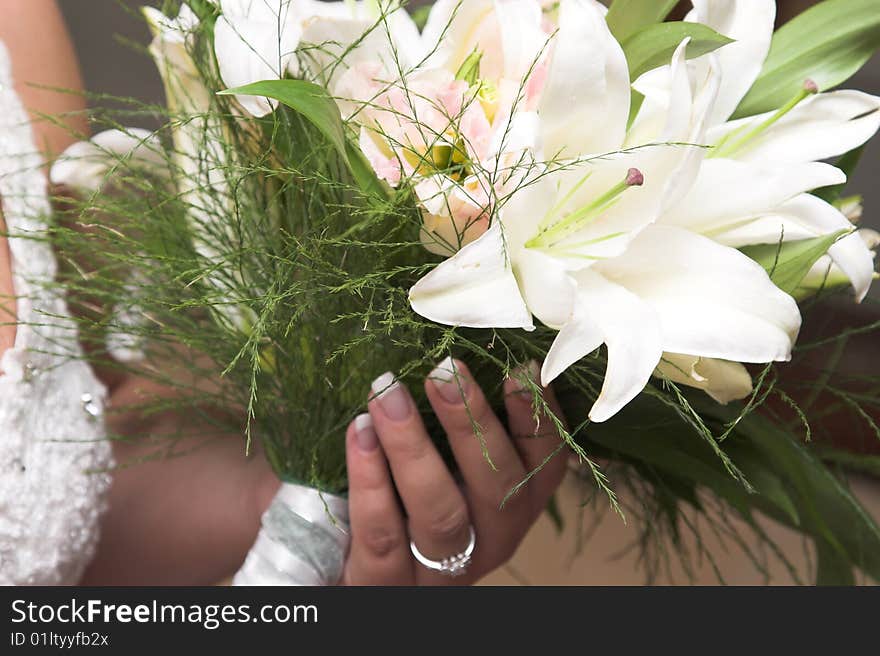 Bride holding a floral bouquet on her wedding day