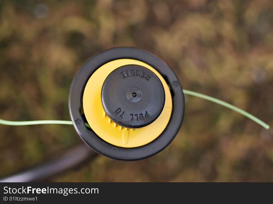 Electric line trimmer head - macro, shallow depth of field