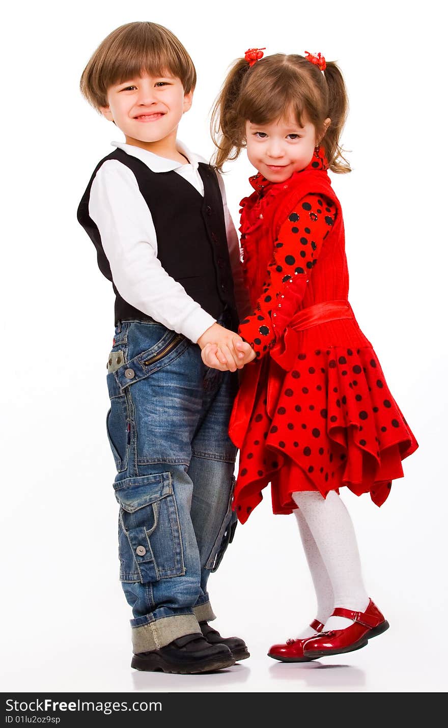 Adorable little boy hugging his sister