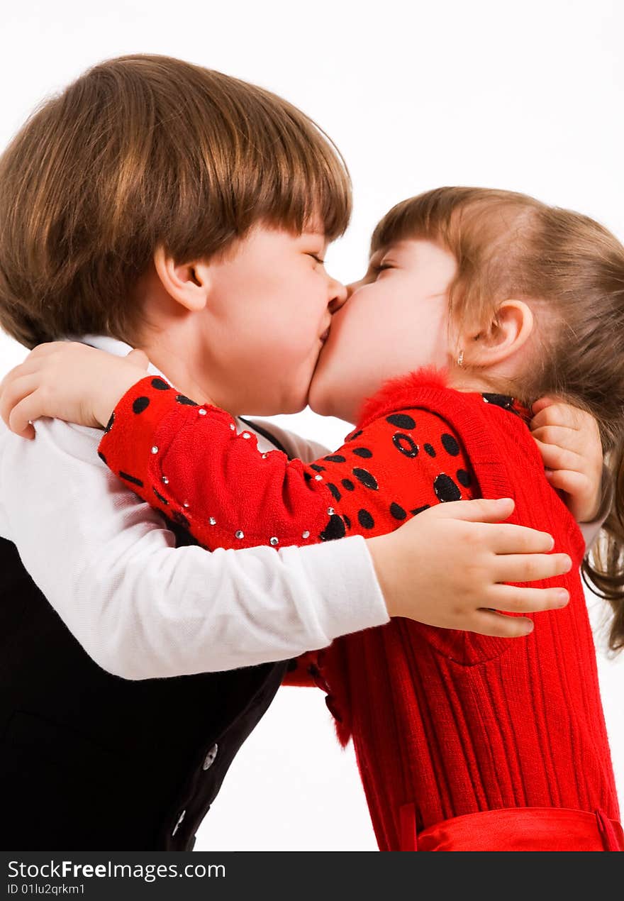 Little brother and sister kissing. Little brother and sister kissing