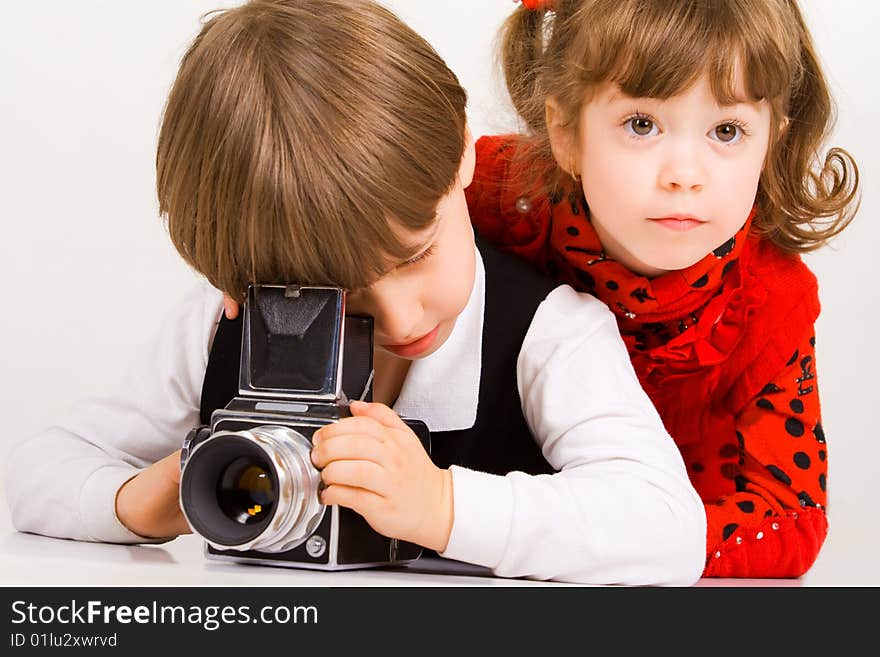 Adorable children taking pictures with photo camera. Adorable children taking pictures with photo camera