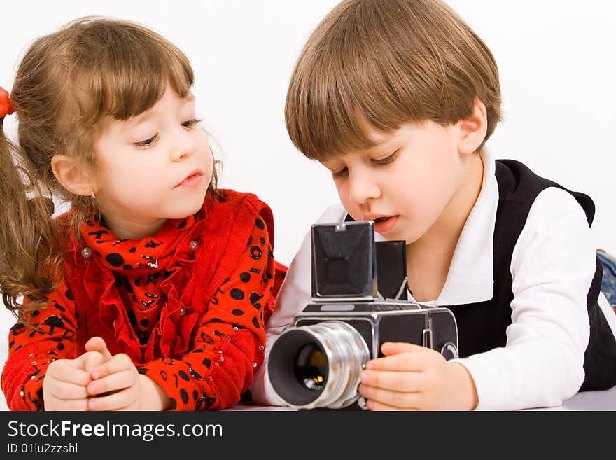 Adorable children taking pictures with photo camera. Adorable children taking pictures with photo camera