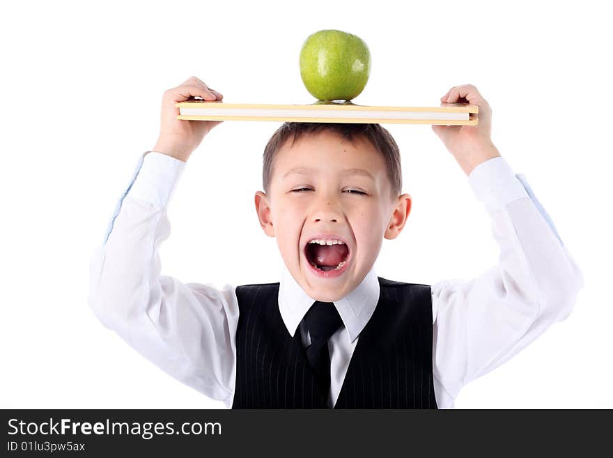 Schoolboy with book and apple isolated on white