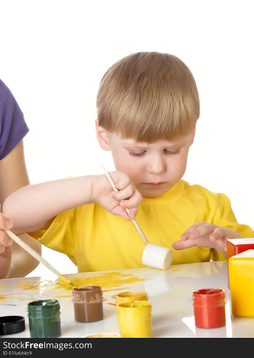 Young mum draws with the son paints. Young mum draws with the son paints