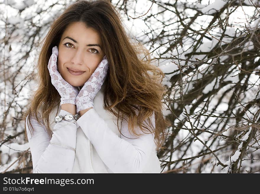 Bride in winter near the tree