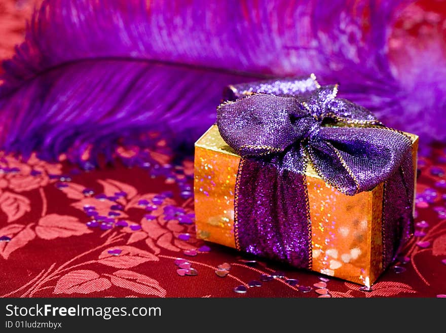 Gift box with violet feather