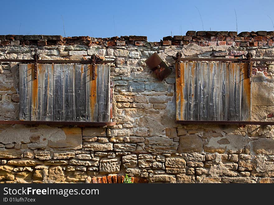 Rolling windows on an ruin farm wall