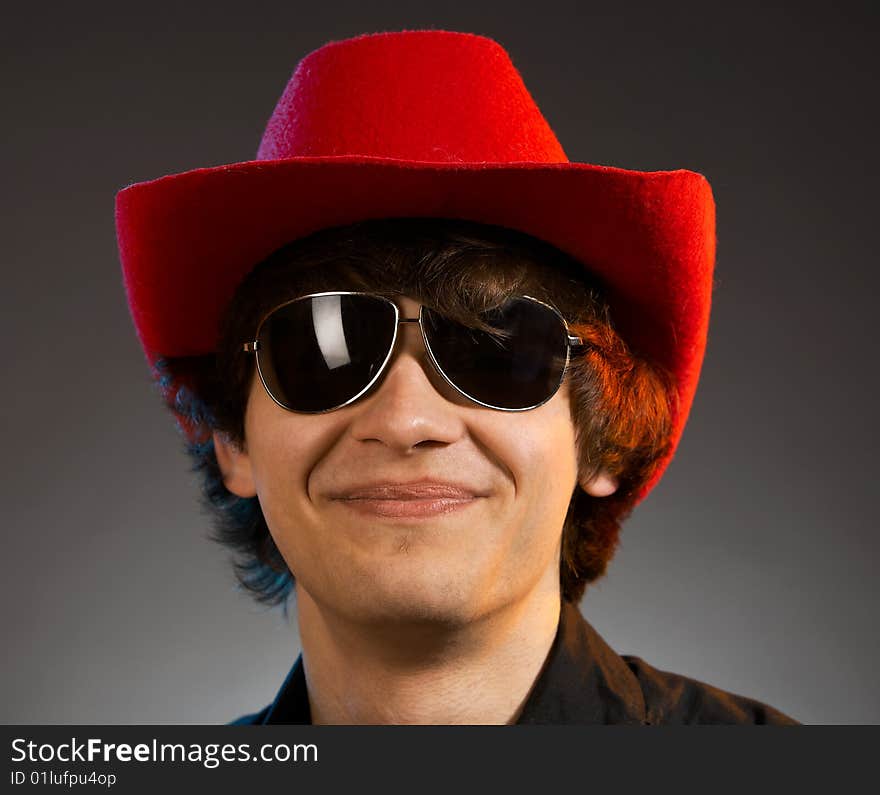 Portrait of young smiling caucasian man over grey background. Portrait of young smiling caucasian man over grey background