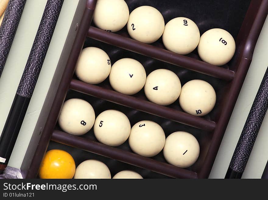 Billiard balls and cue