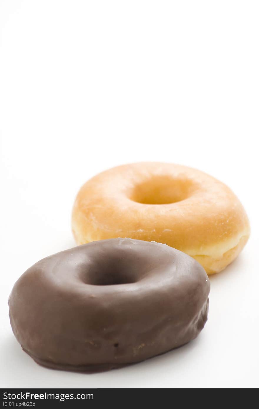 Breakfast glass of chocolate milk and donut isolated