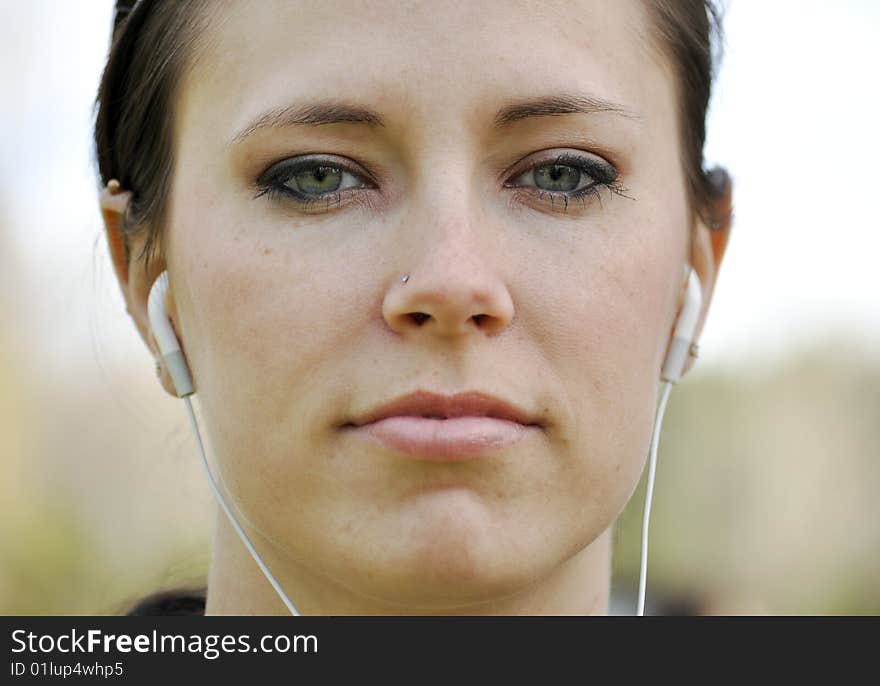 Young woman wearing ear phones. Young woman wearing ear phones