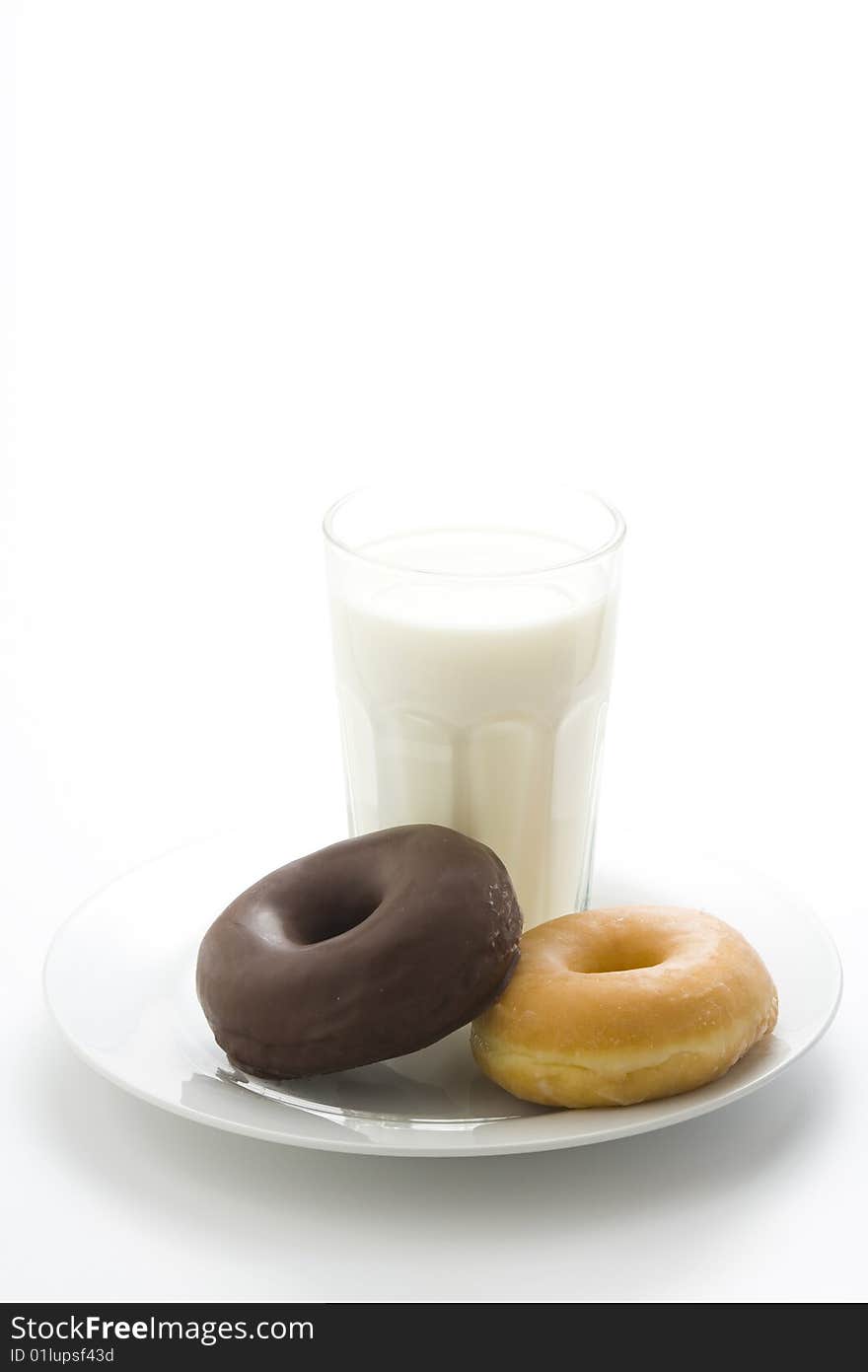 Breakfast glass of chocolate milk and donut isolated