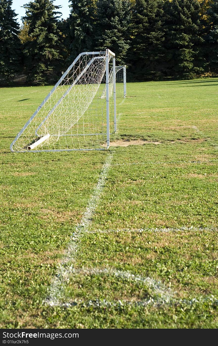 Soccer on baseline of soccer field with painted line. Soccer on baseline of soccer field with painted line