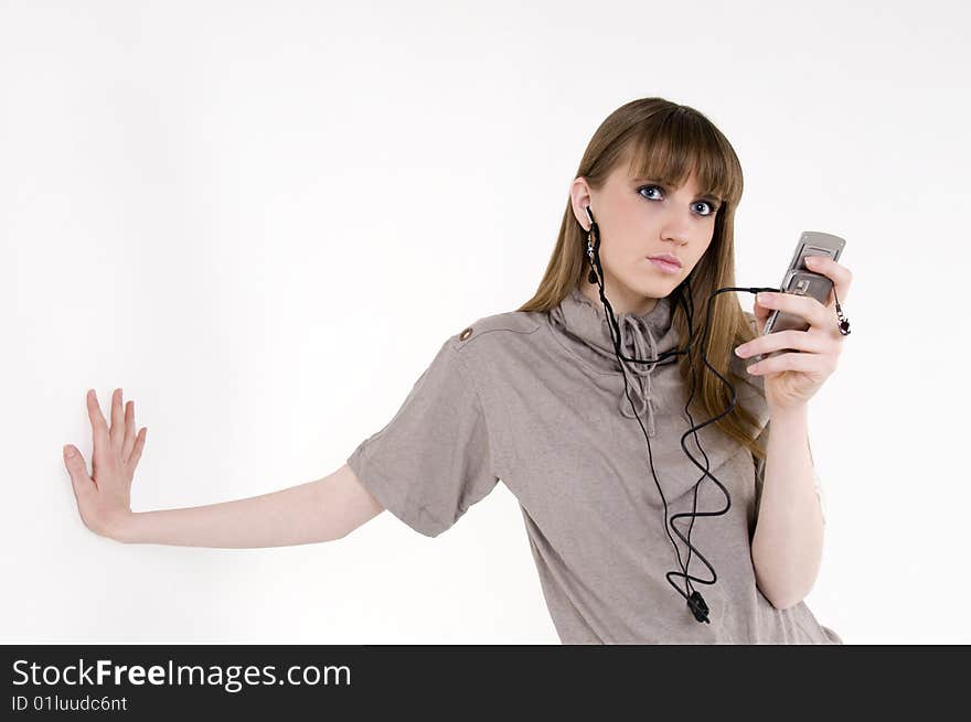 Female model with cellphone and headphones