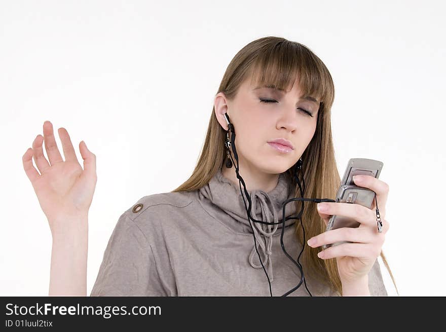 Female model with cellphone and headphones