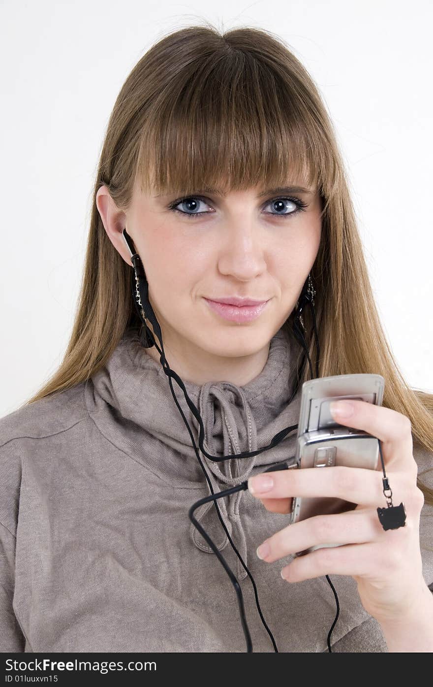 Female model with cellphone and headphones