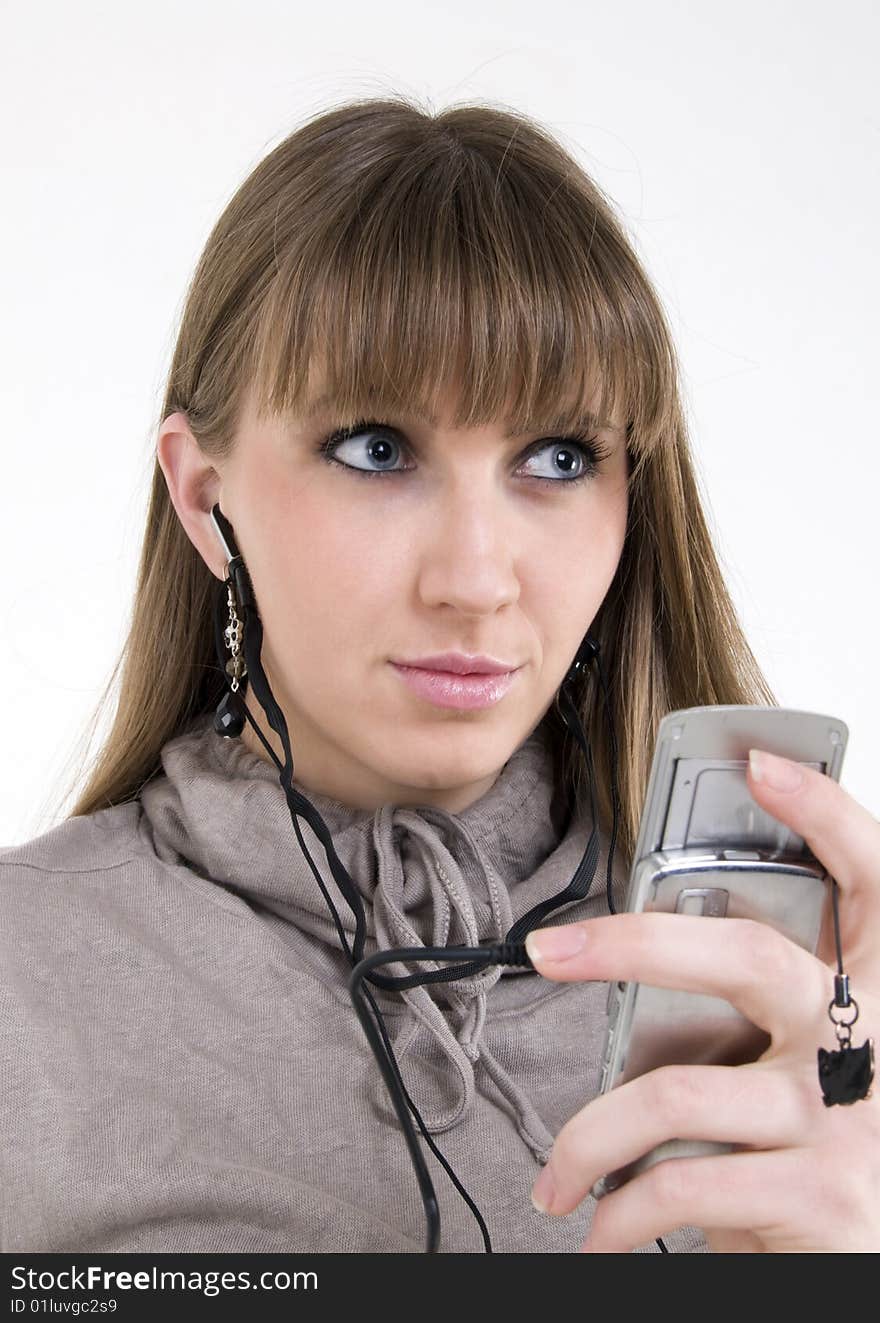 Female model with cellphone and headphones