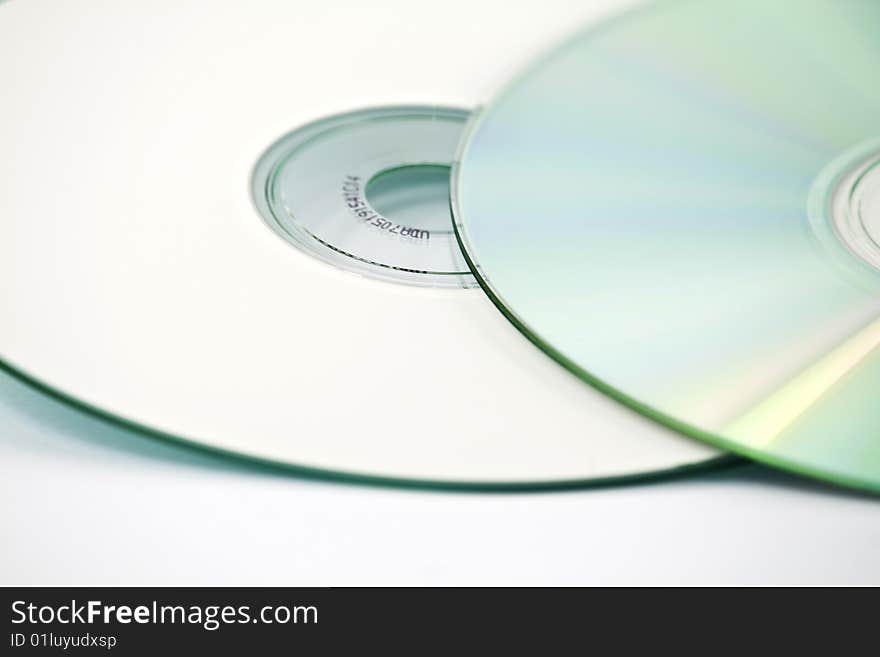 Two CDs, one on top of another, one up-side down, isolated over white. Two CDs, one on top of another, one up-side down, isolated over white