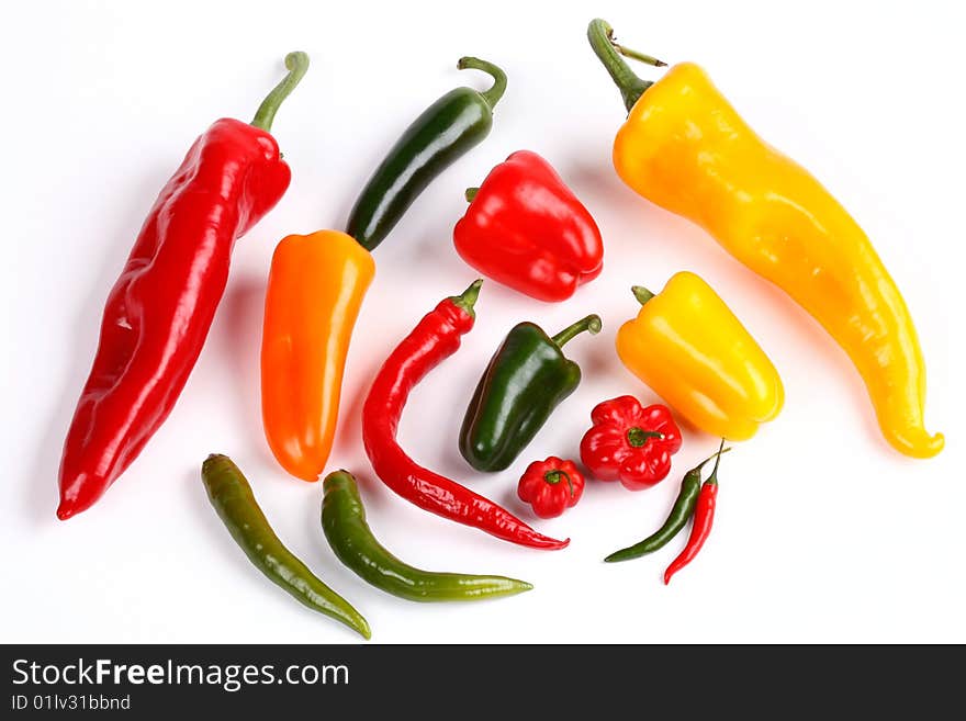 Various peppers on white