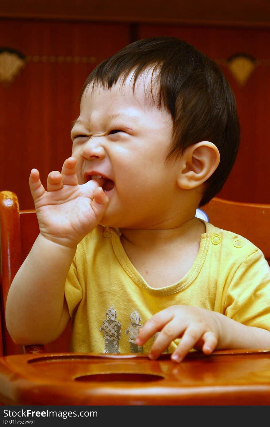 Kid laughing and biting fingers. Kid laughing and biting fingers