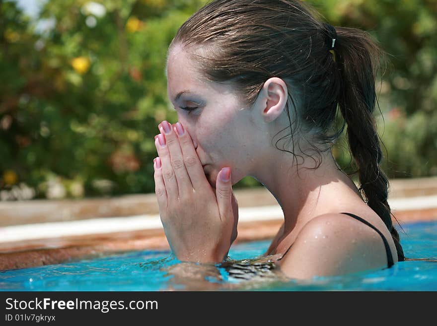 Young woman in the swimming pool