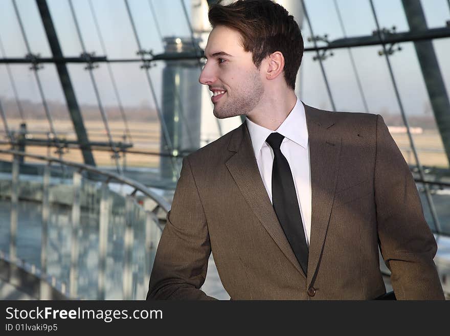 Man in suit stands and wait. Man in suit stands and wait