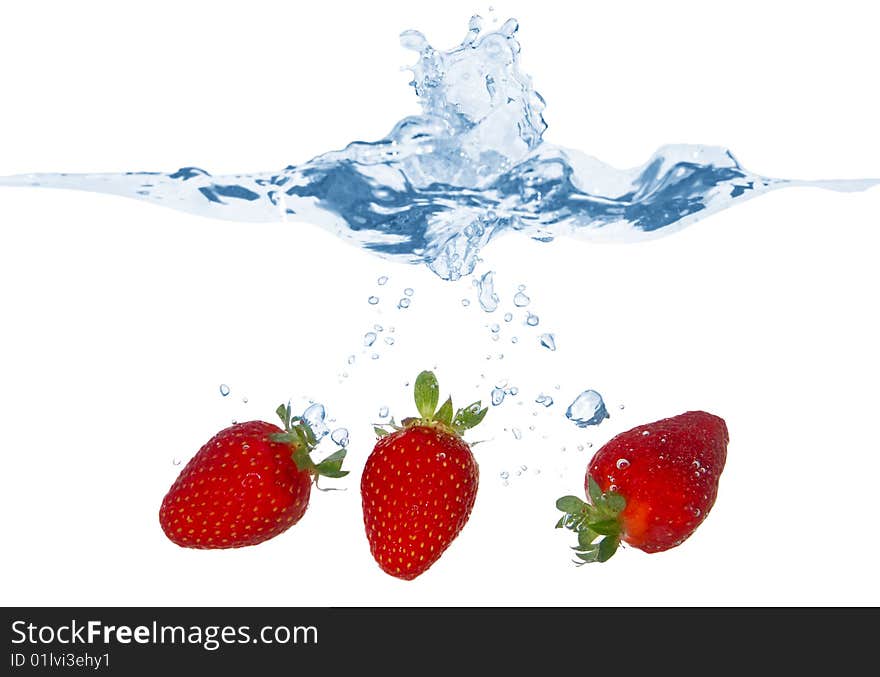 Three Strawberries Falling Into The Water