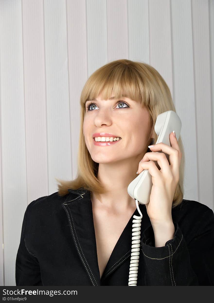 Attractive young woman calling by phone. Attractive young woman calling by phone