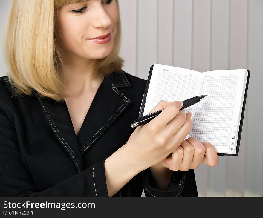 The beautiful businesswoman in a black jacket. The beautiful businesswoman in a black jacket