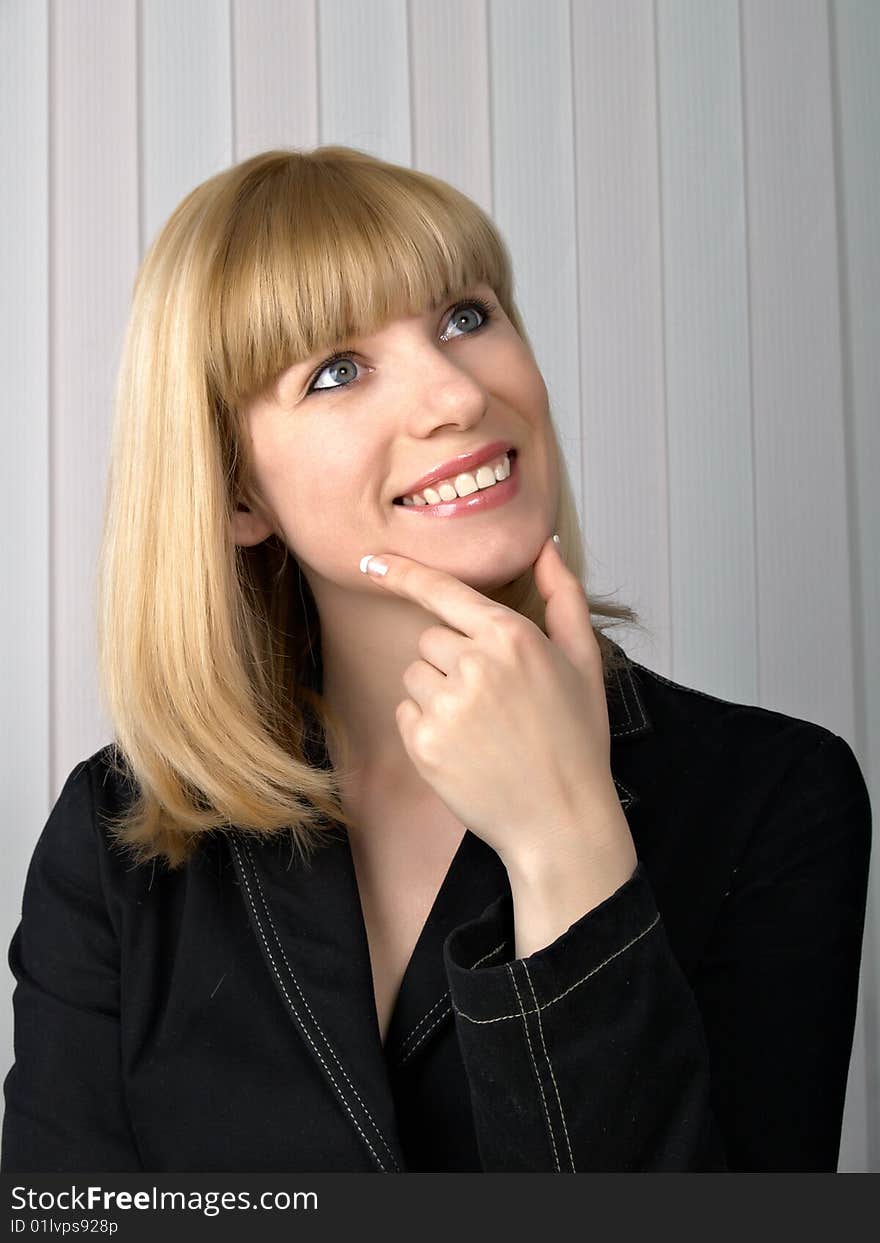 The beautiful businesswoman in a black jacket. The beautiful businesswoman in a black jacket